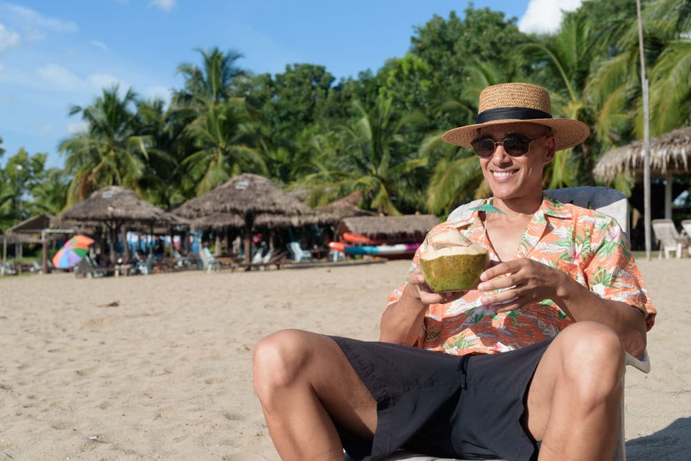 hispanic man tourist sitting and using phone while 2026 01 09 12 04 16 utc